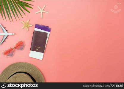 Table top view food items of travel summer holiday & vacation background concept.Flat lay arrangement of passport palm airplane on modern rustic pink paper.copy space for creative design text