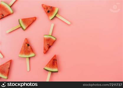 Table top view fruit tropical with drink with spring summer holiday & vacation background concept.Arrangement slices watermelon ice cream pattern on modern pink paper.copy space for design text.