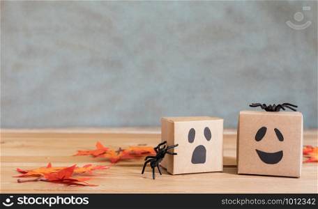 Table top view of decoration Happy Halloween day background holiday concept.Flat lay accessories essential object to party the jack o lantern on gift box on rustic stone.Space for creative design.