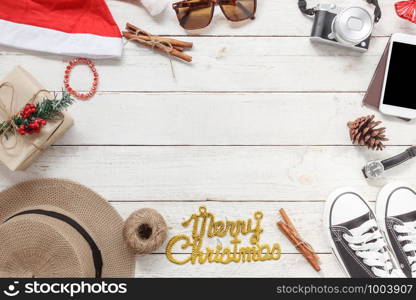 Table top view of ornaments and decorations Merry Christmas and Happy New Year with accessory travel concept background.Essential item on modern rustic white wooden desk.object prepare for travelling.