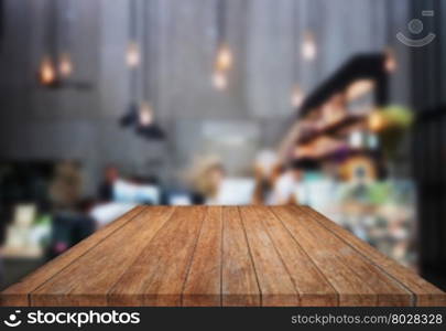 Table top wooden with blurred background in coffee shop, stock photo