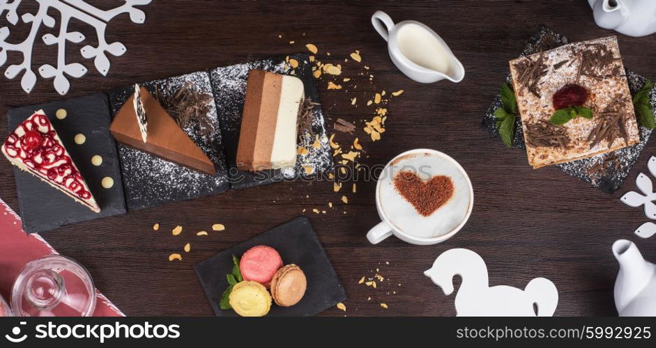 Table with cakes ans coffee cup. Coffee theme photo