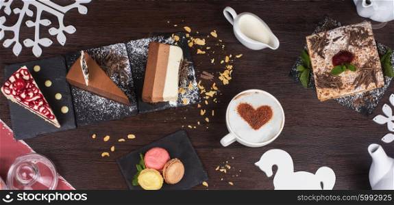 Table with cakes ans coffee cup. Coffee theme photo