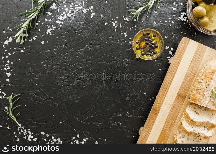 table with cutting board bread with oil