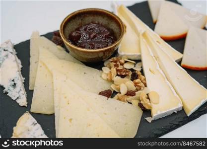 Table with different types of cheese to taste
