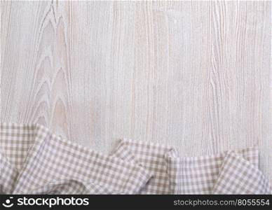 Tablecloth on a white wooden table, top view.background