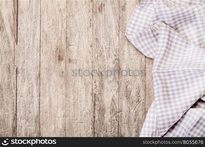 Tablecloth on a white wooden table, top view. background
