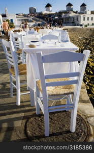 Tables and chairs in a restaurant, Mykonos, Cyclades Islands, Greece