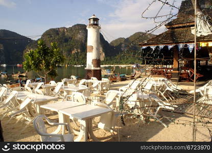 Tables and lighthouse in restaurant