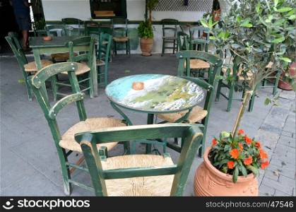 Tables of restaurant on a terrace on the island of Crete