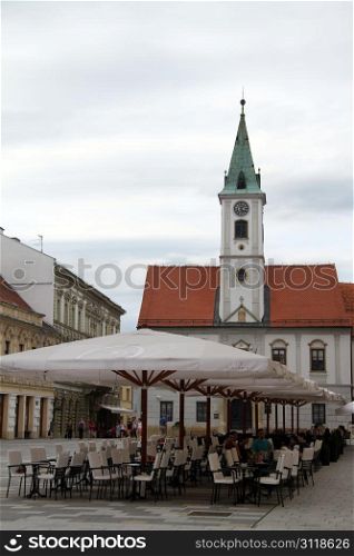 Tables on the square and church in Varazhdin, Croatia