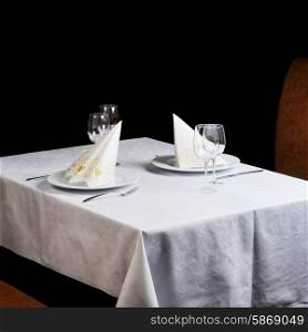 Tables set for meal in modern restaurant