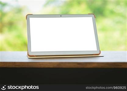 tablet on table isolated screen / Digital tablet compute or laptop blank screen on table nature green background