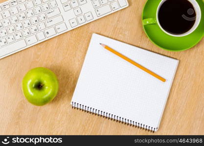 Tablet pc cup of coffee and notepad at table. Work place