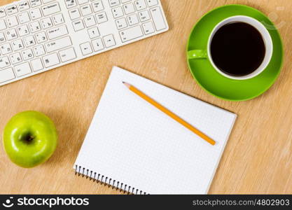 Tablet pc cup of coffee and notepad at table. Work place