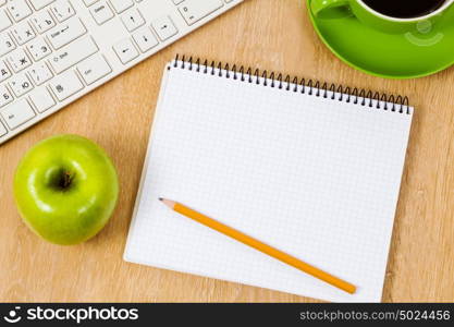 Tablet pc cup of coffee and notepad at table. Work place