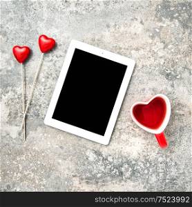 Tablet PC with black screen and hearts decoartion. Valentines Day concept
