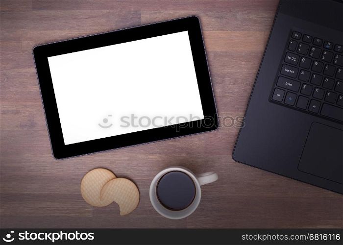 Tablet touch computer gadget on wooden table, vintage look