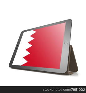 Tablet with Bahrain flag image with hi-res rendered artwork that could be used for any graphic design.. Shareholder word cloud on tablet
