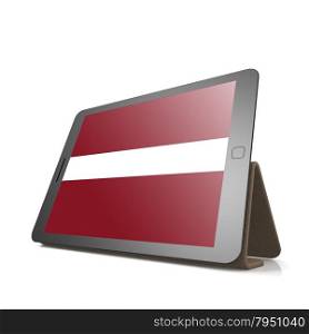 Tablet with Latvia flag image with hi-res rendered artwork that could be used for any graphic design.. Shareholder word cloud on tablet