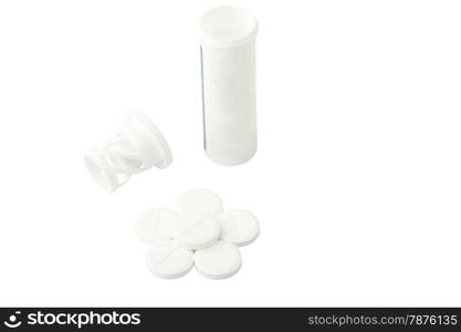 tablets and a bottle with a cover isolated on a white background