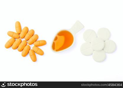 tablets and a medical syrup isolated on a white background