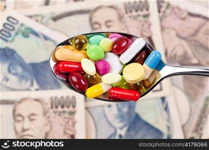 tablets and japanese yen currency symbol for health costs