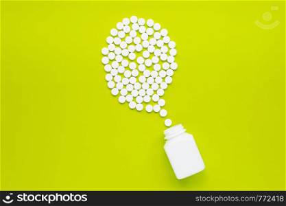 Tablets of Paracetamol on green background. Copy space