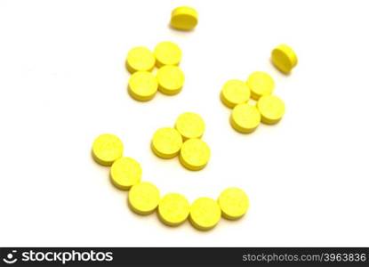 Tablets smiling face on white background