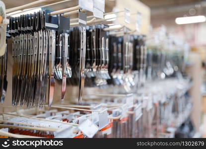 Tableware on the shelf closeup, houseware store, nobody. Home goods in market, kitchenware supply shop products. Tableware on the shelf closeup, houseware store