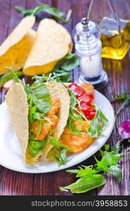 taco with chicken and vegetables on a table