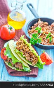 taco with minced meat and tomato sauce