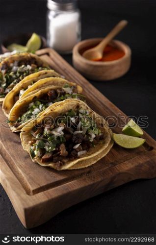 Tacos de Suadero. Fried meat in a corn tortilla. Street food from CDMX, Mexico, traditionally accompanied with cilantro, onion and spicy red sauce
