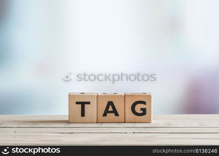 Tag made of wooden cubes on a table