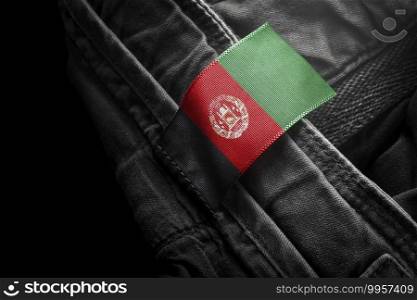 Tag on dark clothing in the form of the flag of the Afghanistan.. Tag on dark clothing in the form of the flag of the Afghanistan