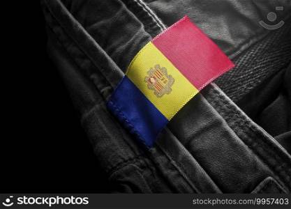 Tag on dark clothing in the form of the flag of the Andorra.. Tag on dark clothing in the form of the flag of the Andorra