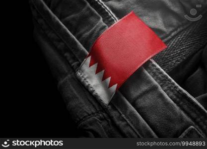 Tag on dark clothing in the form of the flag of the Bahrain.. Tag on dark clothing in the form of the flag of the Bahrain