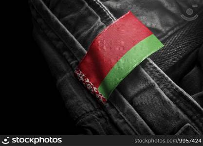 Tag on dark clothing in the form of the flag of the Belarus.. Tag on dark clothing in the form of the flag of the Belarus