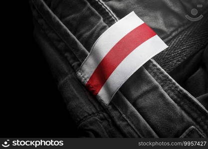 Tag on dark clothing in the form of the flag of the Belarus.. Tag on dark clothing in the form of the flag of the Belarus