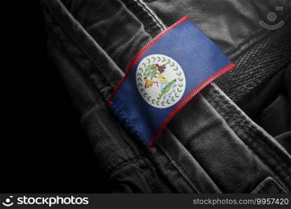 Tag on dark clothing in the form of the flag of the Belize.. Tag on dark clothing in the form of the flag of the Belize