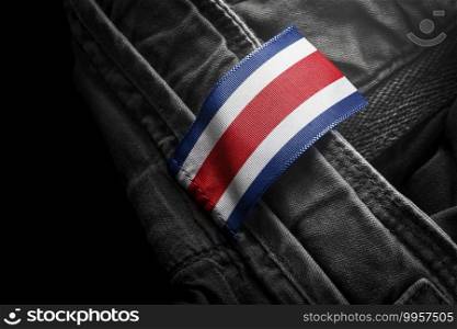 Tag on dark clothing in the form of the flag of the Costa Rica.. Tag on dark clothing in the form of the flag of the Costa Rica