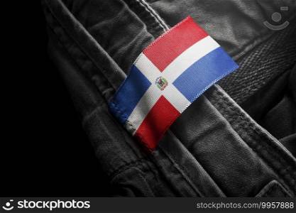 Tag on dark clothing in the form of the flag of the Dominicana.. Tag on dark clothing in the form of the flag of the Dominicana