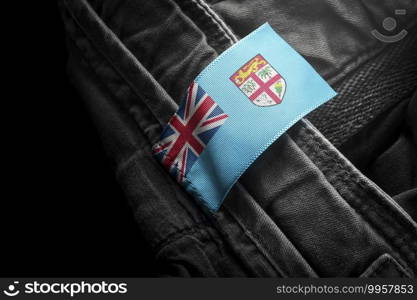 Tag on dark clothing in the form of the flag of the Fiji.. Tag on dark clothing in the form of the flag of the Fiji