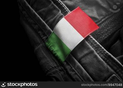 Tag on dark clothing in the form of the flag of the Italy.. Tag on dark clothing in the form of the flag of the Italy