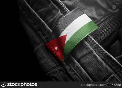 Tag on dark clothing in the form of the flag of the Jordan.. Tag on dark clothing in the form of the flag of the Jordan