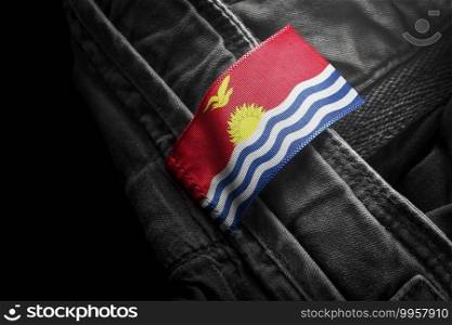 Tag on dark clothing in the form of the flag of the Kiribati.. Tag on dark clothing in the form of the flag of the Kiribati