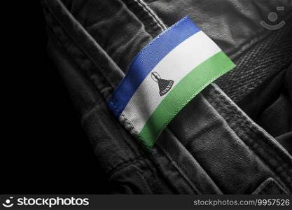 Tag on dark clothing in the form of the flag of the Lesotho.. Tag on dark clothing in the form of the flag of the Lesotho