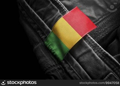 Tag on dark clothing in the form of the flag of the Mali.. Tag on dark clothing in the form of the flag of the Mali