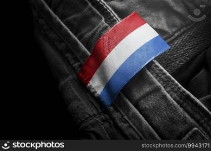 Tag on dark clothing in the form of the flag of the Netherlands.. Tag on dark clothing in the form of the flag of the Netherlands