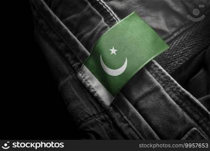 Tag on dark clothing in the form of the flag of the Pakistan.. Tag on dark clothing in the form of the flag of the Pakistan